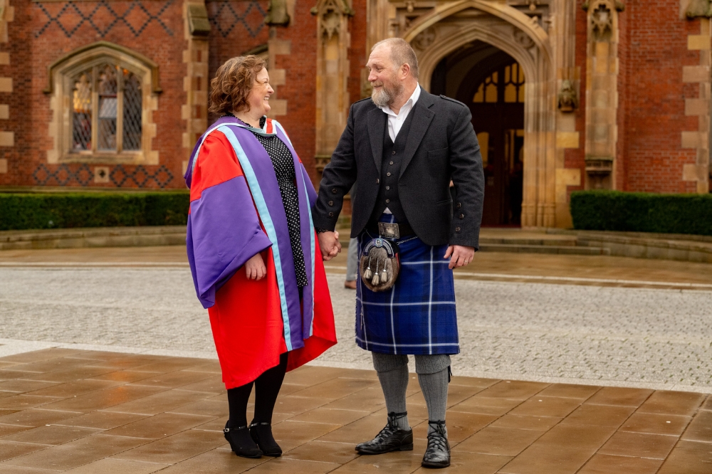 mature student celebrates graduating with her husband at Winter graduation 2023