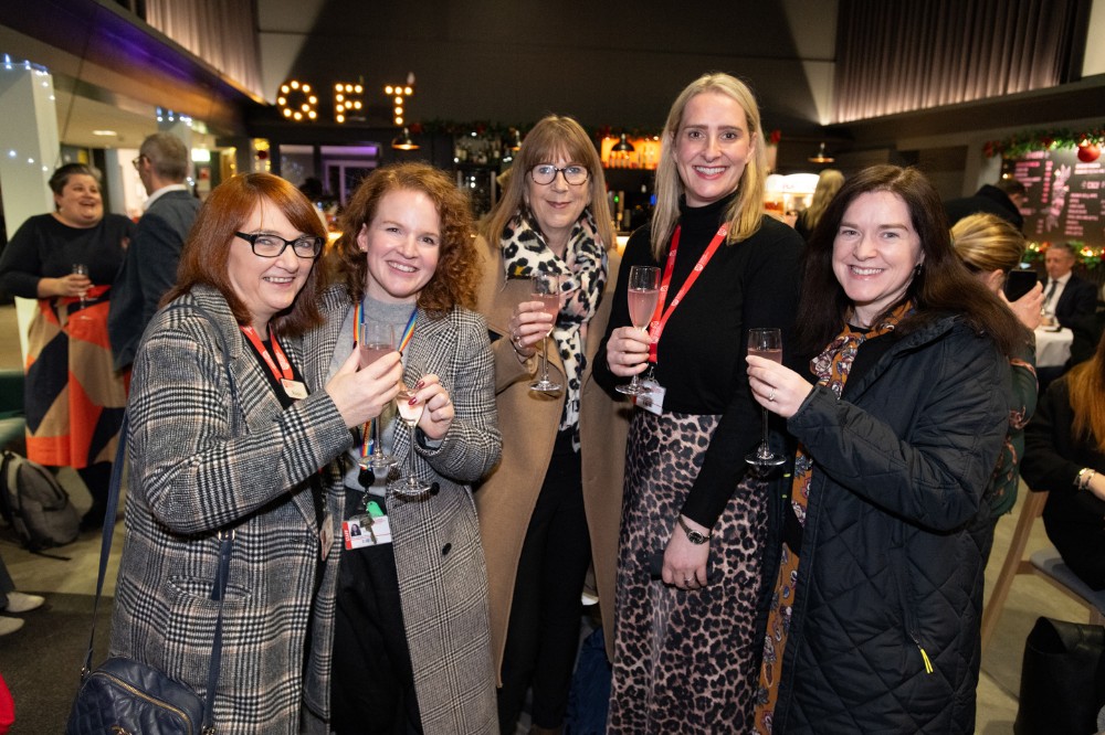 staff at a reception in the QFT foyer ahead of the screening of 'Delivering the Impossible: Agreement Twenty Five' documentary, 5 December 2023.