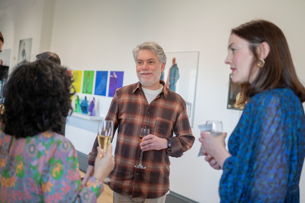 staff chatting at the launch of Queen's new Staff Network for Promoting Linguistic Diversity and Minority Languages, in the Naughton Gallery