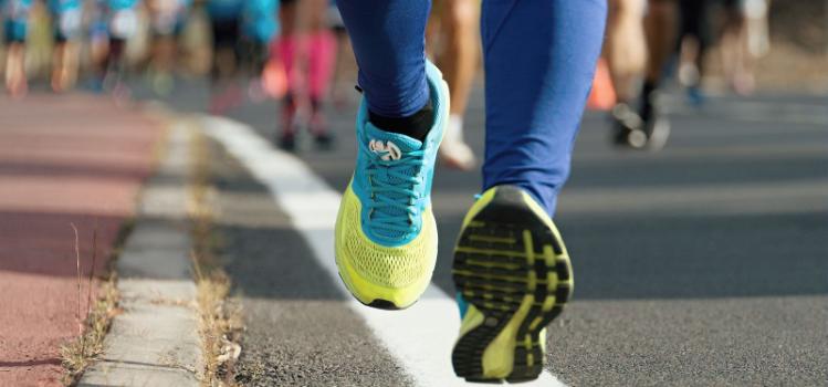 road-level shot showing feet of person running