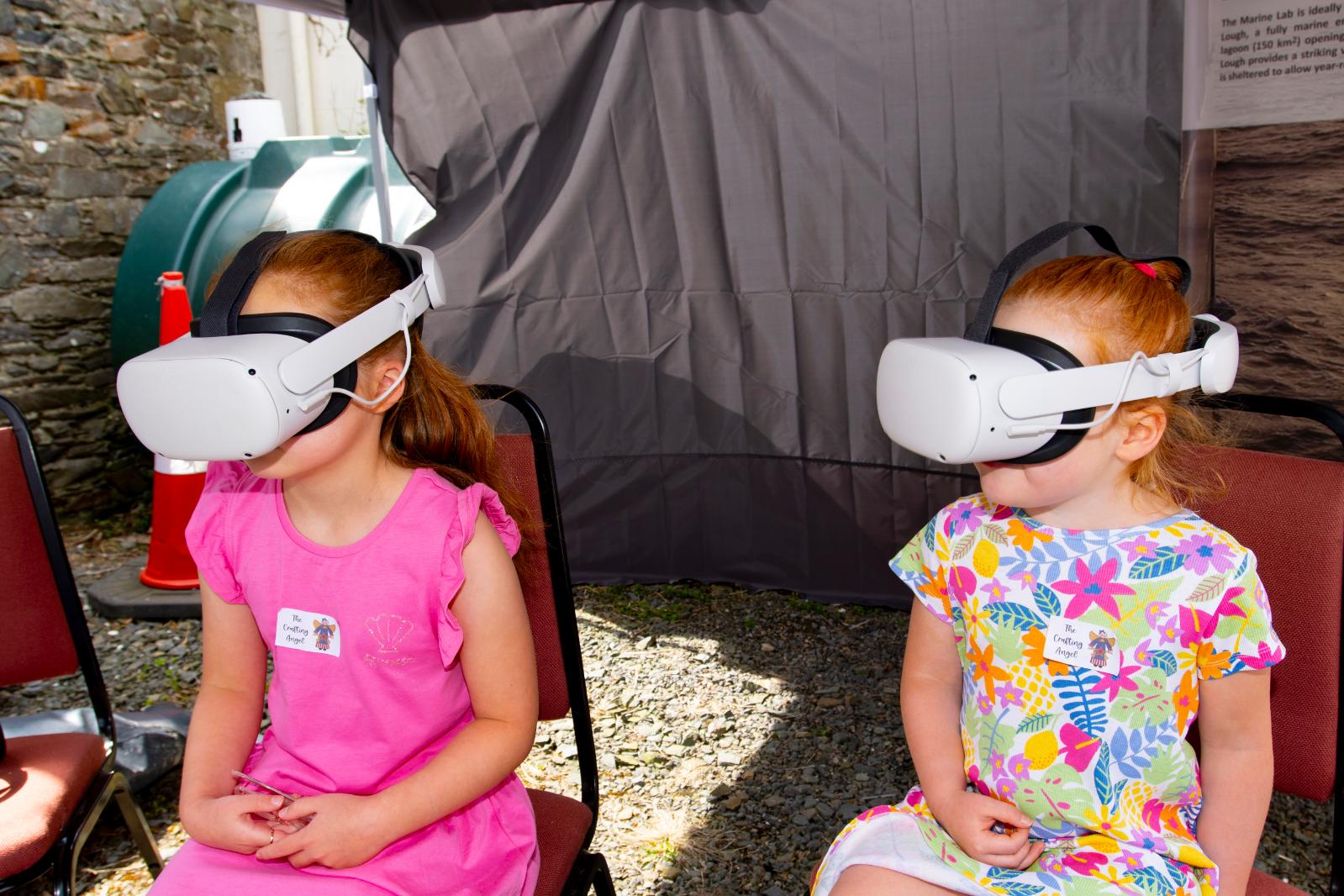 two young girls wearing VAR headsets at the Queen's University Belfast Marine Laboratory Open Day 2024