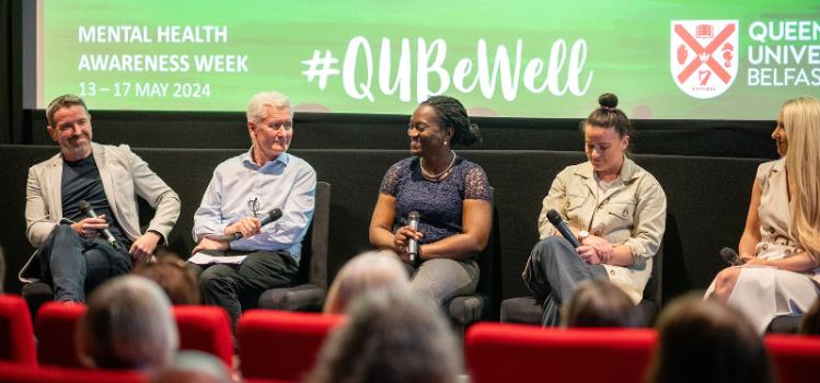 panel members on stage at the Mental Health Awareness Week 2024 panel discussion in Queen's Film Theatre